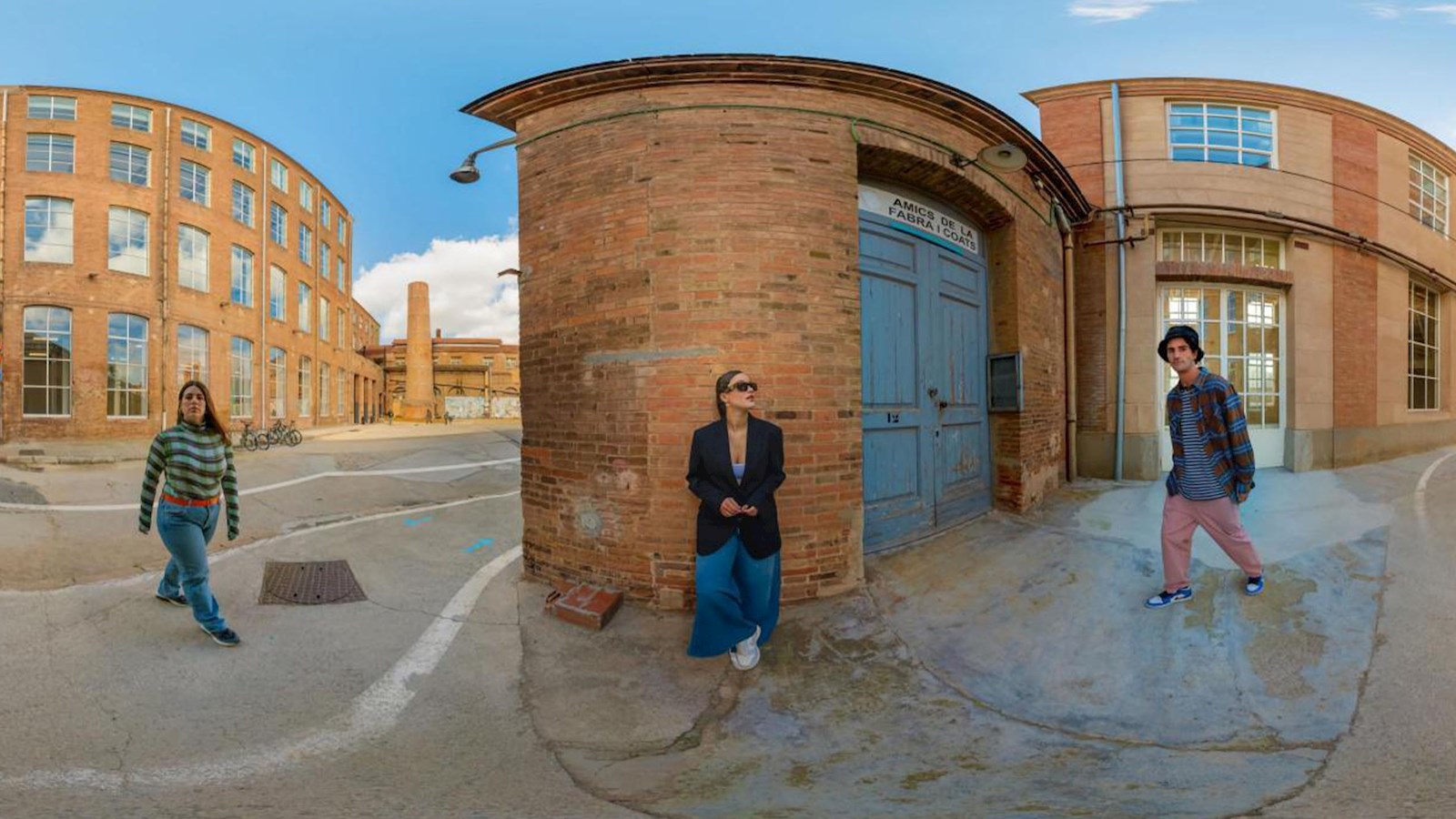 Three people standing on the street with a fish eye effect on the camera
